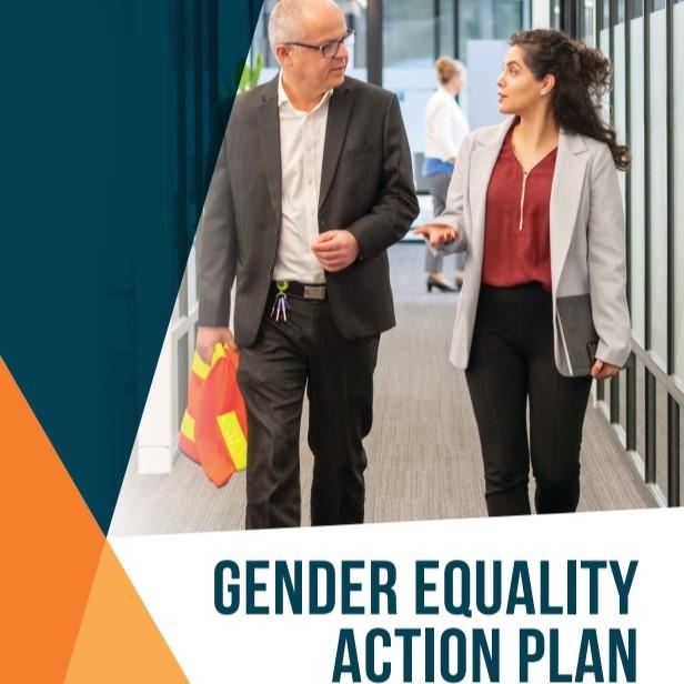 Front cover of Council's Gender Equality Action Plan. Two employees, man and a woman are walking through the office talking to each other